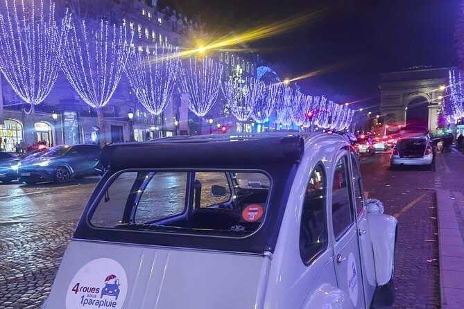 The Champs-&Eacute;lys&eacute;es trees strung with Christmas lights towards the Arc de Triomphe
