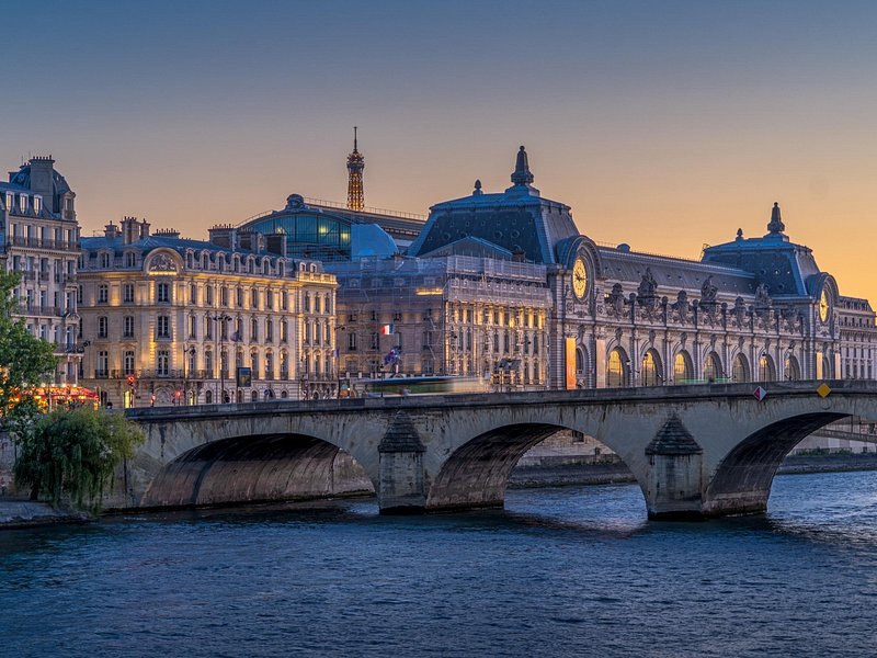 The Mus&eacute;e d'Orsay lit along the left bank with the river in front