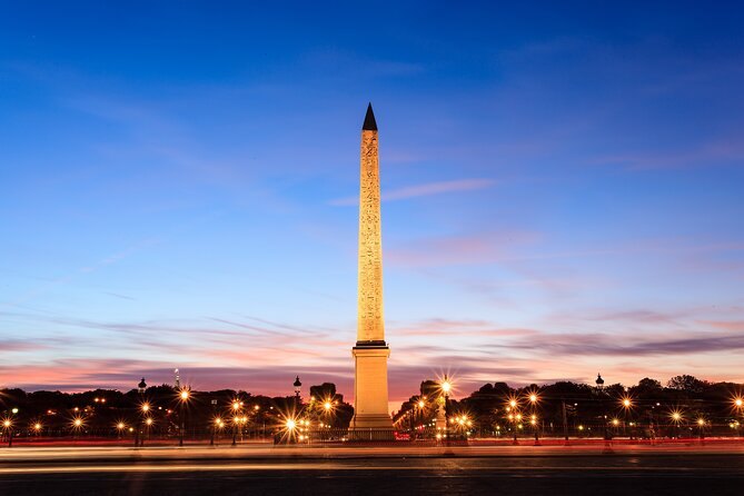 The Luxor obelisk on Place de la Concorde against a fading sunset